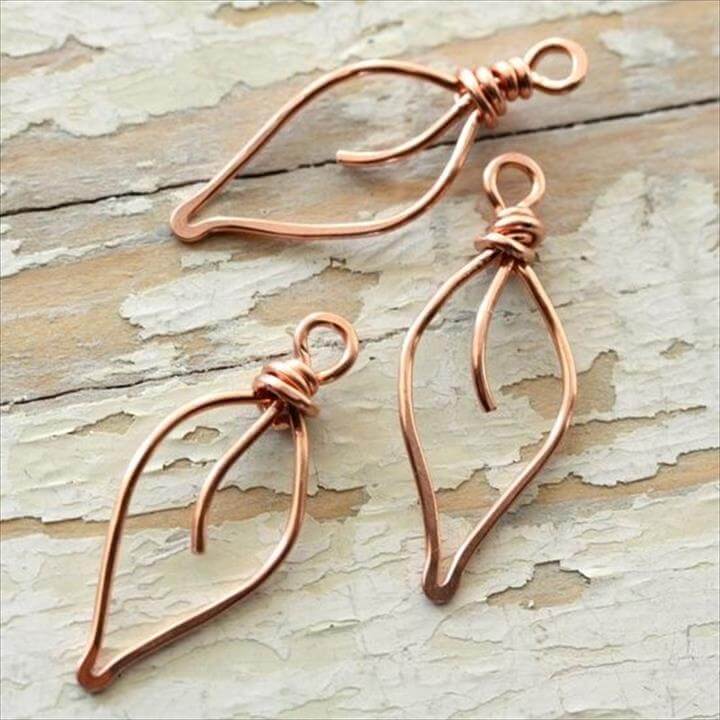 Close-up of a beginner-friendly copper wire-wrapped ring with spiral detailing